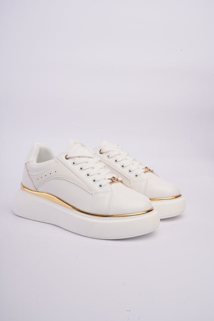 Tenis plataforma blancos con dorado y diseño texturizado