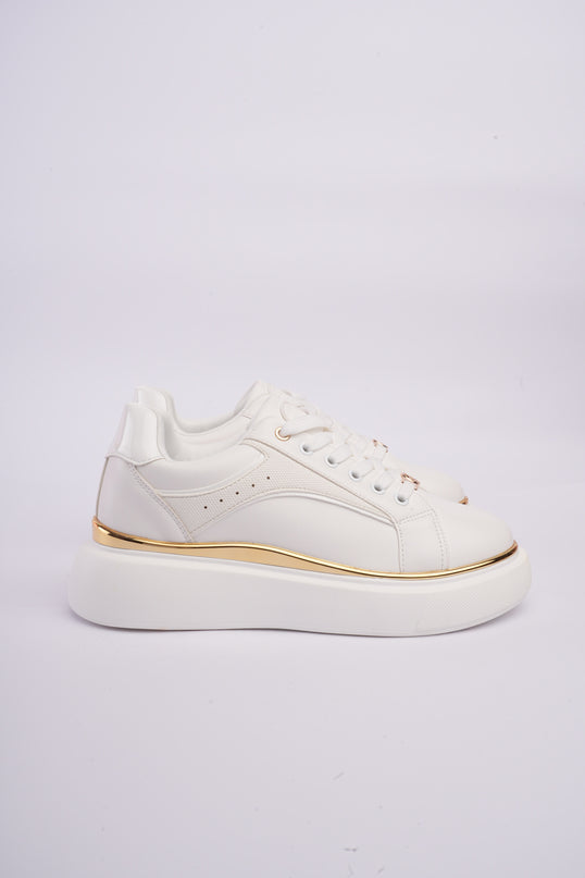 Tenis plataforma blancos con dorado y diseño texturizado