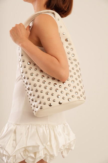Bolso grande blanco con taches