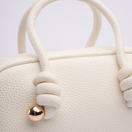 Bolso mini blanco con textura