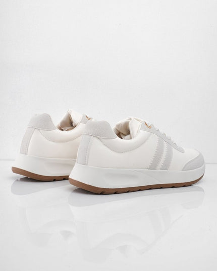 Tenis blancos con líneas y puntera gris