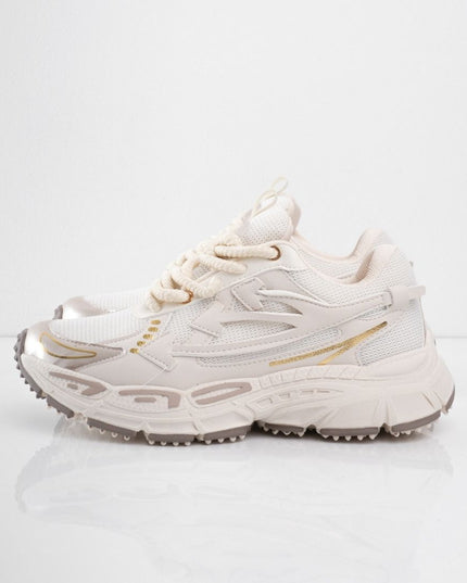 Tenis beige con líneas doradas
