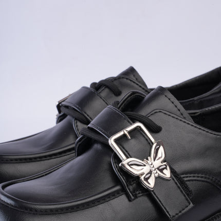 Mocasines elegantes negros con hebilla mariposa