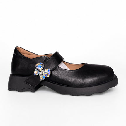 Mocasines negros con aplique mariposa