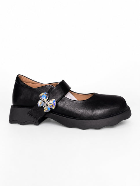 Mocasines negros con aplique mariposa