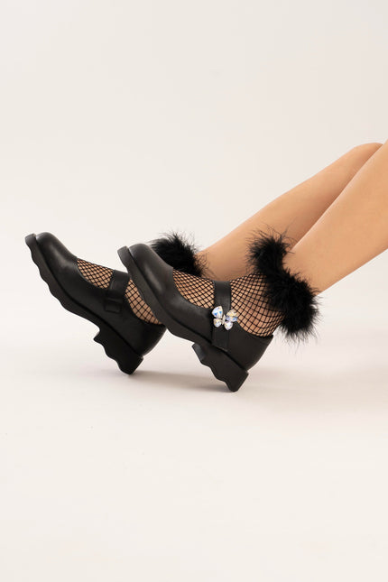Mocasines negros con aplique mariposa