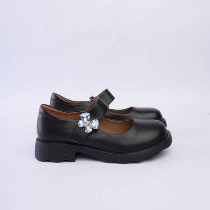 Mocasines negros con aplique mariposa