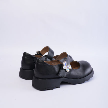Mocasines negros con aplique mariposa