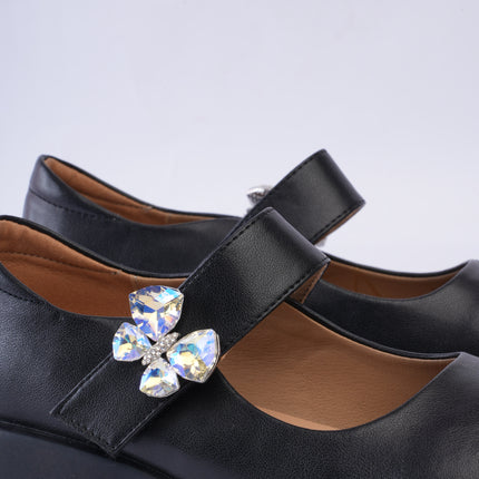 Mocasines negros con aplique mariposa