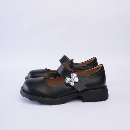 Mocasines negros con aplique mariposa