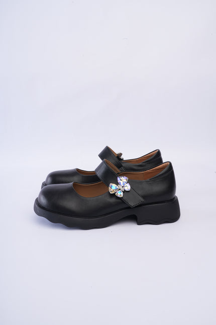 Mocasines negros con aplique mariposa