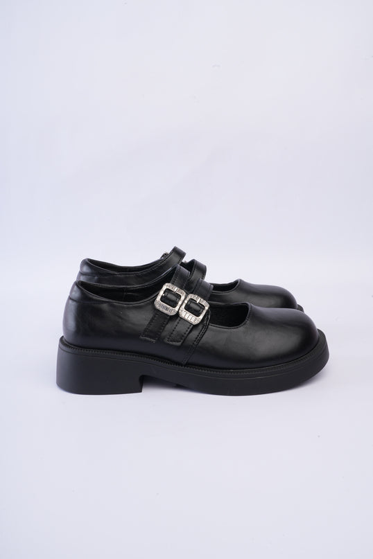 Mocasines negros con doble hebilla