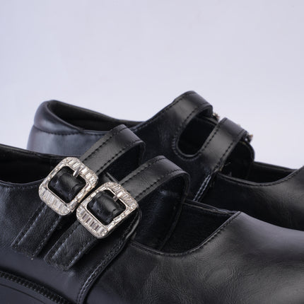 Mocasines negros con doble hebilla
