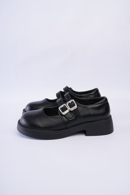 Mocasines negros con doble hebilla