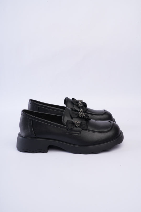 Mocasines negros con moños