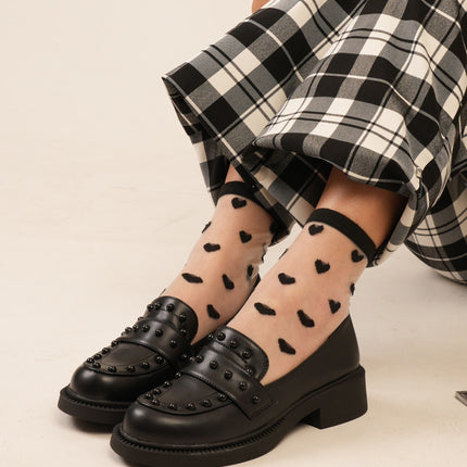 Mocasines negros planos con taches