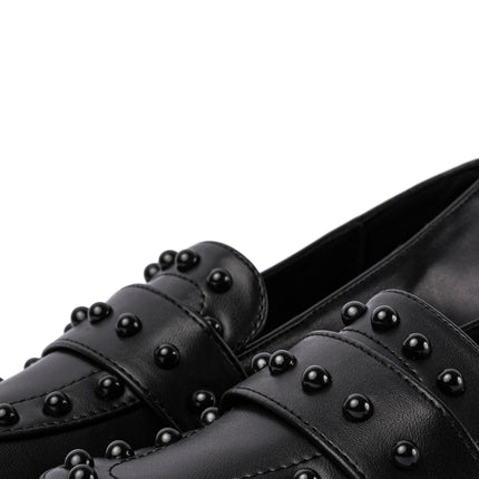 Mocasines negros planos con taches
