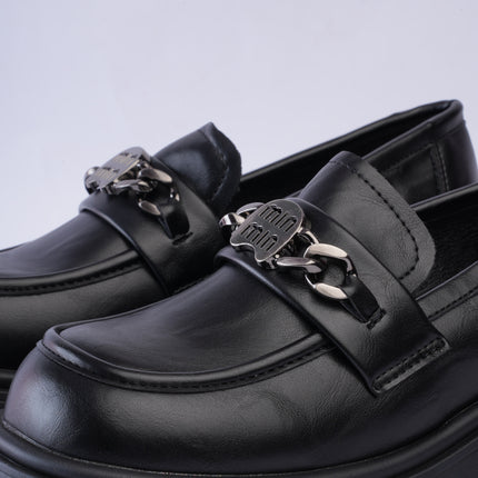 Mocasines negros plataforma con aplique