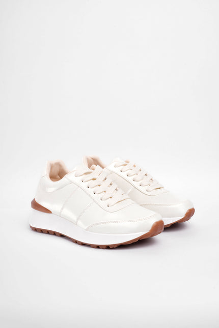 Tenis bajos crema brillantes
