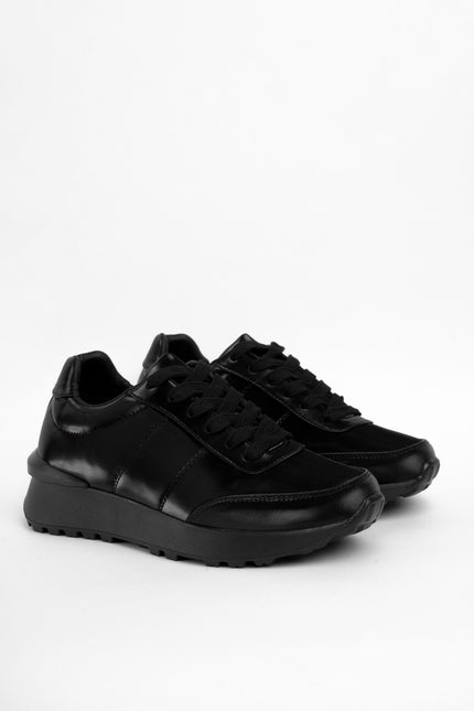 Tenis bajos negros brillantes