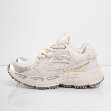 Tenis beige con líneas doradas
