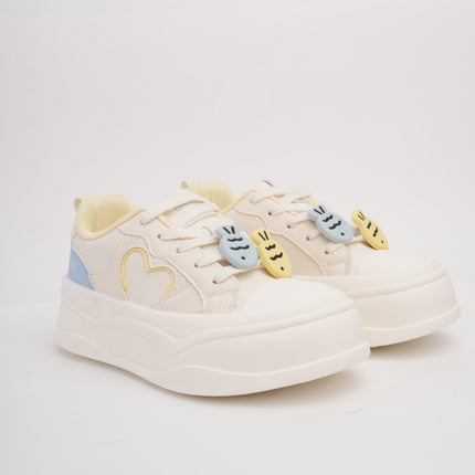 Tenis crema con detalles azul y amarillo