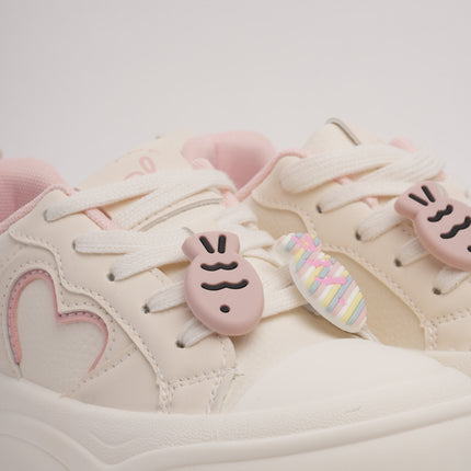 Tenis crema con detalles rosa