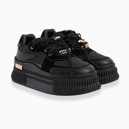 Tenis negros con plataforma y toques dorados